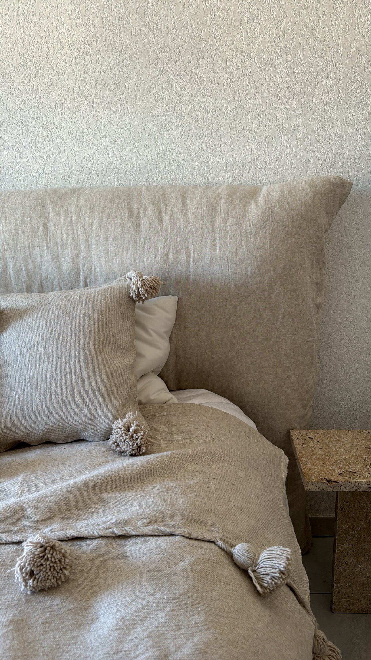 Coussin à pompons