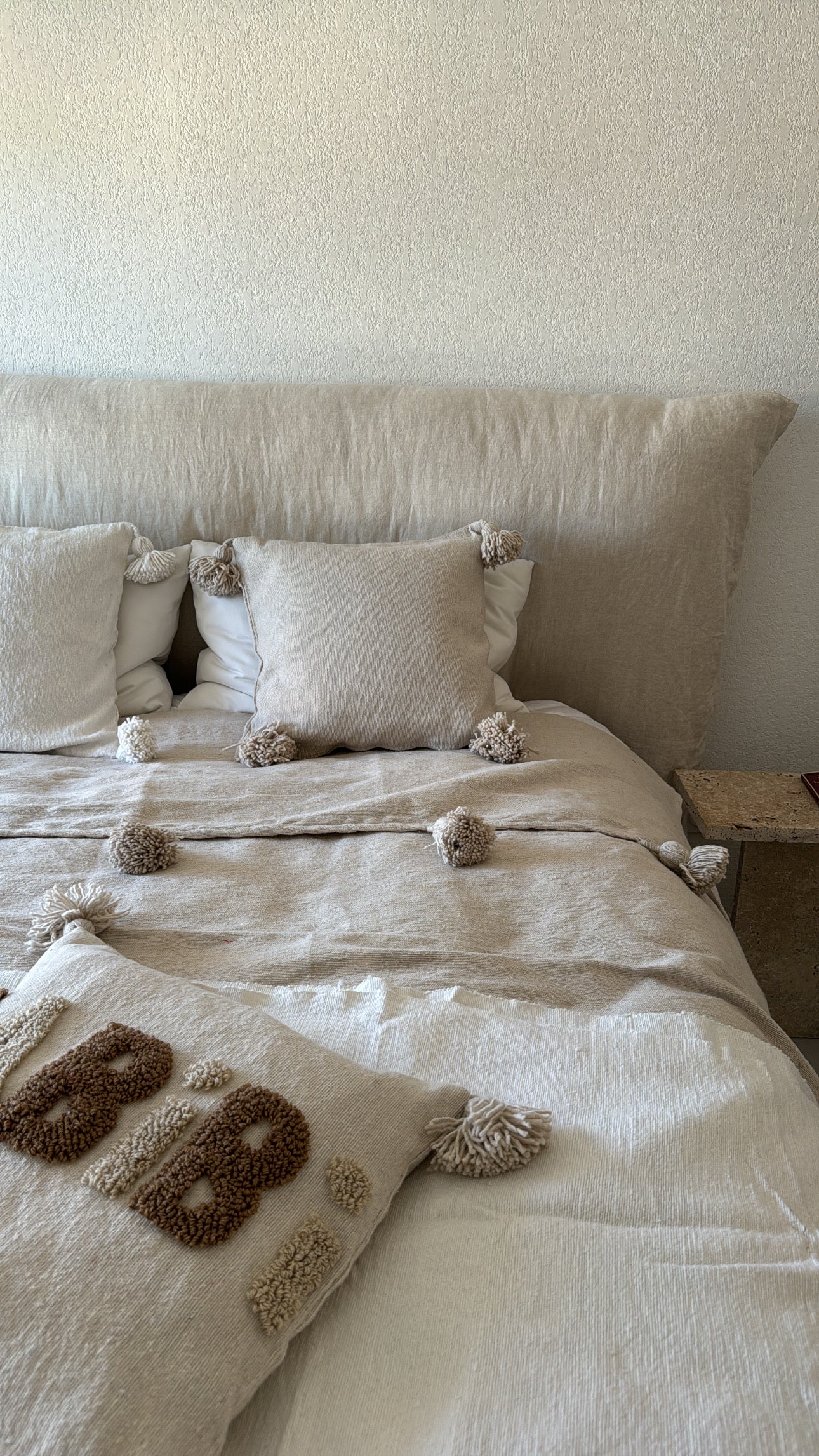 Coussin à pompons